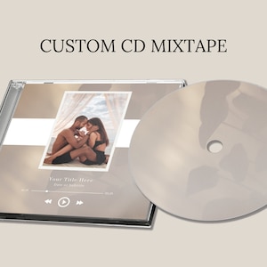 May include: A custom CD mixtape with a beige background and a photo of a couple in the center. The text "Your Title Here" and "Date or Subtitle" are below the photo. The CD case has a play button and rewind buttons.