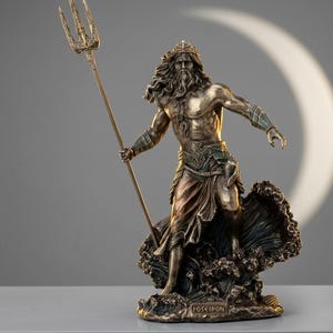 May include: A bronze statue of Poseidon, the Greek god of the sea, holding a trident. The statue shows Poseidon with long hair and a beard, standing on a wave base. The word "POSEIDON" is inscribed on the base.