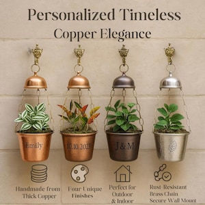 May include: Four copper hanging planters with different finishes and personalized names. The planters are hanging from a chain and have a dome-shaped top. The plants are green and leafy. The text on the planters reads "Emily", "10.10.2023", "J&M", and a leaf design. The text below the planters reads "Handmade from Thick Copper", "Four Unique Finishes", "Perfect for Outdoor & Indoor", and "Rust-Resistant Brass Chain Secure Wall Mount".