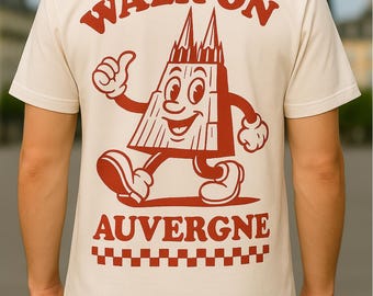 Puede incluir: Camiseta blanca con un gráfico rojo de un edificio de dibujos animados con el texto "WALK ON AUVERGNE" debajo.