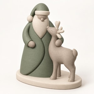 May include: A decorative figurine featuring a stylized Santa Claus figure in a muted sage green coat and hat, standing beside a light beige reindeer. Both figures have a smooth, matte finish and are mounted on a matching oval base.