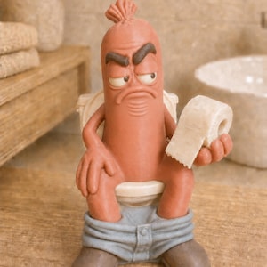 May include: A brown, anthropomorphic sausage figurine with a grumpy facial expression, sitting on a white toilet. The figure wears blue trousers pulled down to the ankles, brown shoes, and holds a small roll of white toilet paper in one hand.