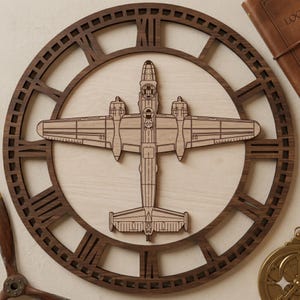 May include: A wooden wall clock featuring a detailed laser-cut design. The clock face has a light wood background with a dark brown Roman numeral clock frame. A wooden airplane is centered on the clock face.