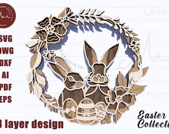 May include: A 3-layer laser cut design of a wreath with two bunnies and Easter eggs. The wreath is made of wood and has a brown stain. The bunnies are facing each other and have long ears. The eggs are decorated with bows. The design is perfect for Easter decorations.