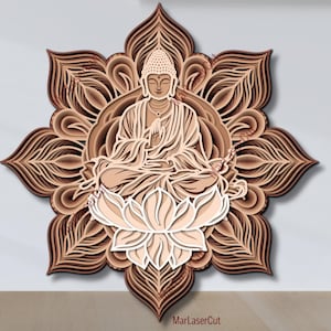 May include: A brown wooden mandala featuring a white lotus flower and a beige Buddha figure in the centre. The mandala is intricately carved with layers of detail.