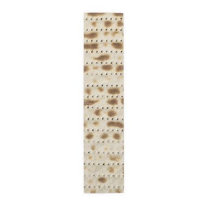 May include: A rectangular piece of matzah, a traditional unleavened bread. The matzah is light beige with darker brown spots and small, evenly spaced perforations. The bread is presented against a plain white background.