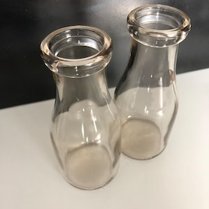 Two Vintage Pint Size Milk Bottles