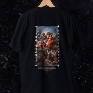 May include: Black t-shirt featuring a Renaissance-style painting on the back. The artwork depicts figures in a celestial scene with the word "Renaissance" printed vertically on both sides of the image. A quote is printed at the bottom.
