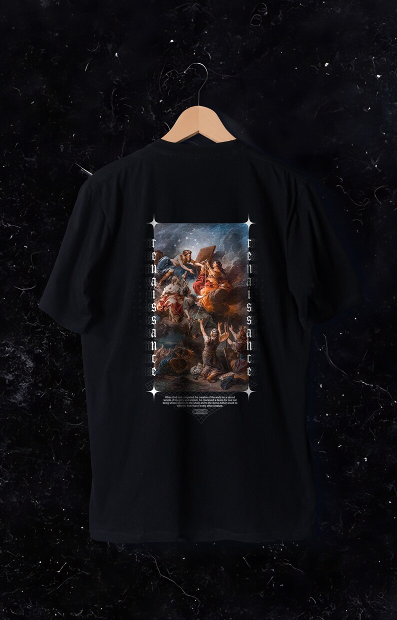 May include: Black t-shirt featuring a Renaissance-style painting on the back. The artwork depicts figures in a celestial scene with the word "Renaissance" printed vertically on both sides of the image. A quote is printed at the bottom.