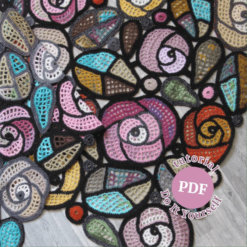 May include: A close-up of a crocheted blanket with a variety of colorful flowers. The blanket is made with a variety of different stitches and colors. The blanket is laid out on a wooden surface. The text "tutorial PDF Do It Yourself" is visible in the lower right corner of the image.