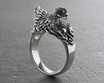 ポピ族スターリングシルバー 鳥模様 アクセサリー スターリングシルバー製ニワトリリング：巣の中の雌鶏をモチーフにした