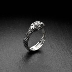 Whether you're dressing up for a night out or adding a touch of edge to your everyday look, this ring is the perfect choice. Order yours today and let the serpent's mystique and power bring some spice into your style!