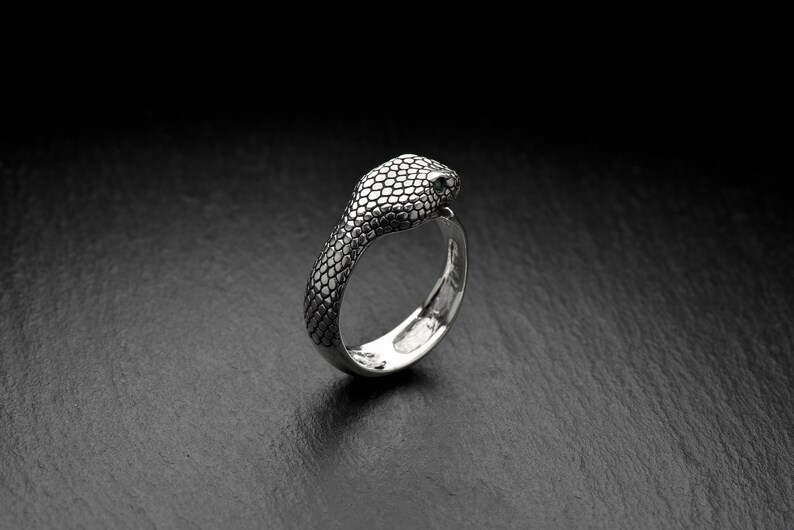 Whether you're dressing up for a night out or adding a touch of edge to your everyday look, this ring is the perfect choice. Order yours today and let the serpent's mystique and power bring some spice into your style!