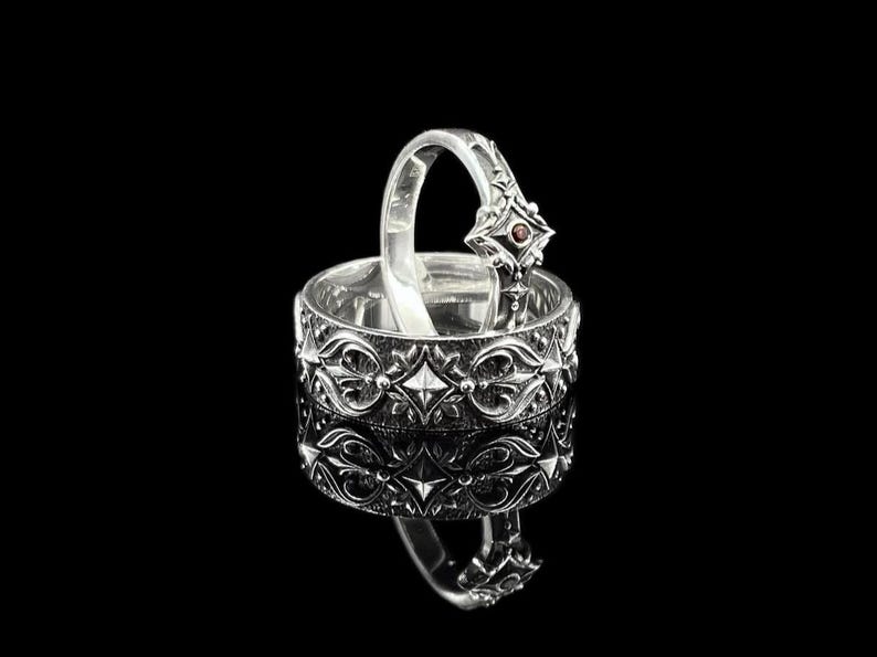 Not Your Average Wedding Rings
Ditch the ordinary and choose a unique matching ring set designed to tell your story. These handmade sterling silver engagement and wedding rings feature bold gothic artistry — a perfect fit for couples who walk their own path. The masculine band and the delicately detailed feminine ring make this set a powerful symbol of balance and unity.
Great for weddings, engagements, or as a meaningful anniversary gift.