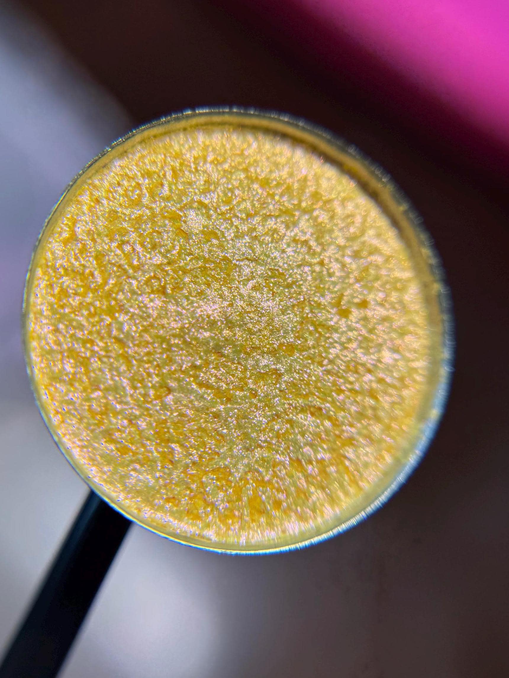 Daffodil is a hand pressed multichrome shimmer 26mm single eyeshadow topper