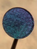 Peacock Veil is a hand pressed silk metallic multichrome 26mm single eyeshadow