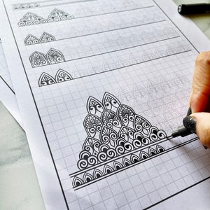 May include: A black and white mandala pattern sheet with a gridded background. The sheet includes a series of patterns that can be combined to create more complex designs. The text "MANDALA PATTERN SHEET - Combining Patterns" is at the top of the sheet.