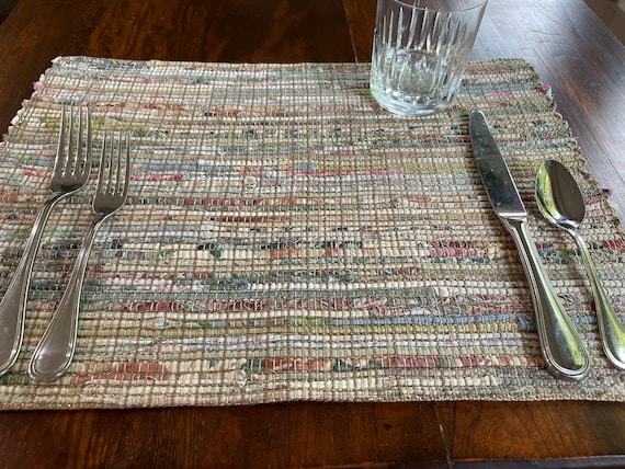 Handwoven upcycled cotton blend placemat in ivory based warm earthtones. Eco friendly, washable.  Sold individually and tariff exempt.
