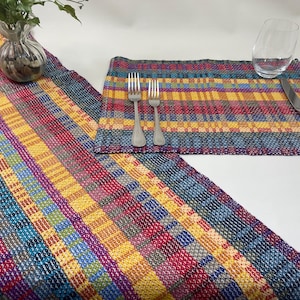 Handwoven runners and placemats. 100% Canada sourced cotton in rich stripes of blue,red, green, gold. Many length options. Tariff exempt.