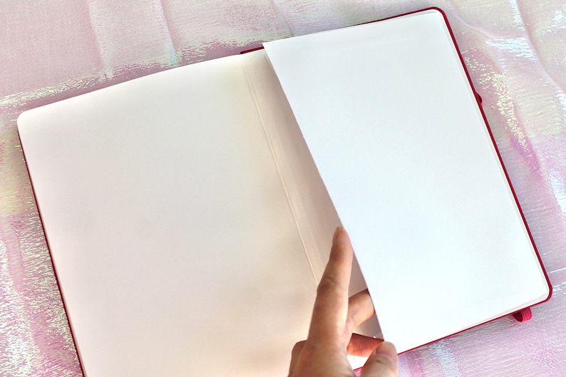 Dot Grid Journal, Dot Grid Journal, Travel Journal, Reading Journal, Journals and Notebooks, Junk Journal, Dot Grid Notebook, Halloween Gift. A pink notebook with white pages. The notebook is open and the pages are fanned out. The notebook has a ribbon bookmark.