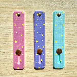 Kindle fingergrepp, Kindle-grepp, Kindle-grepprem, Kindle-grepphållare, Kindle-grepp självhäftande, Kindle-remgrepp, Kindle-remhållare