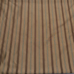 May include: A textile fabric featuring a repeating vertical striped pattern. The design consists of alternating thin lines in dark brown, muted tan, and soft teal blue, creating a textured appearance across the entire surface of the material.