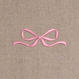 Sewing ribbon bow on linen fabric
