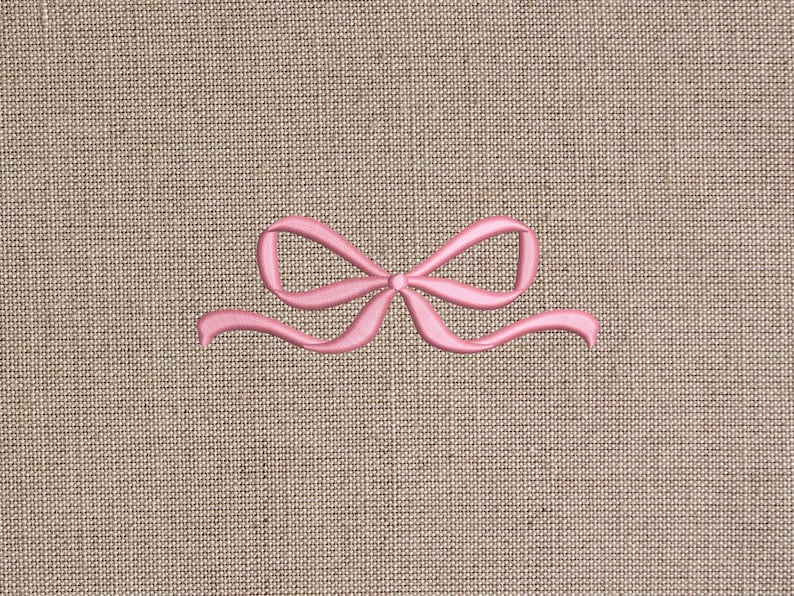 Sewing ribbon bow on linen fabric