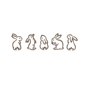 May include: Five line drawings of white rabbits in different poses. The rabbits are outlined in brown and are facing different directions.