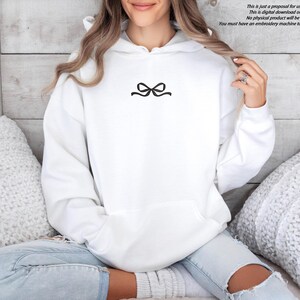 A black embroidered ribbon bow on a sweatshirt can be an example of a gift.