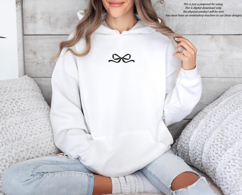 A black embroidered ribbon bow on a sweatshirt can be an example of a gift.