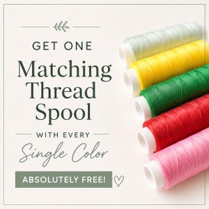 May include: Five spools of sewing thread in light blue, yellow, green, red, and pink arranged diagonally. The text reads: GET ONE Matching Thread Spool WITH EVERY Single Color ABSOLUTELY FREE! A small leaf icon and a heart symbol are included.