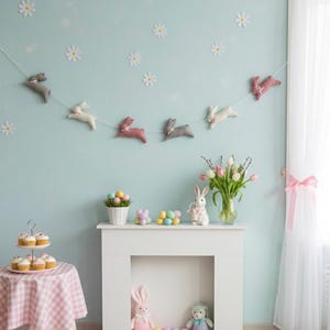 May include: An Easter-themed room with a white fireplace, a table with cupcakes, and a garland of bunny decorations. The wall is decorated with daisy cutouts. A vase of tulips and a bunny figurine are on the mantelpiece.