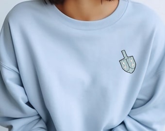 Geborduurd dreidel-sweater: minimalistische Chanoeka-sweater