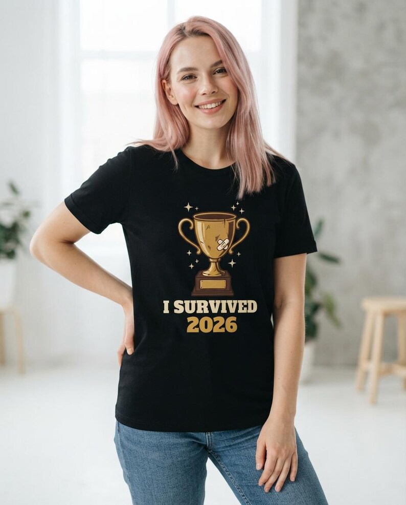 I Survived 2026 Trophy Tee, Funny Battered Trophy Shirt, We Made It Top Bild 8