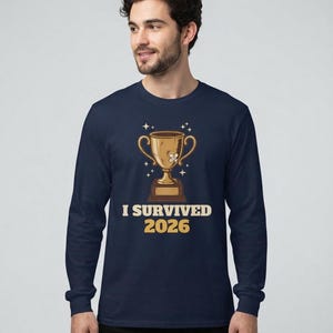 I Survived 2026 Trophy Tee, Funny Battered Trophy Shirt, We Made It Top Bild 6