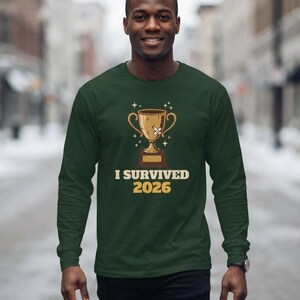 I Survived 2026 Trophy Tee, Funny Battered Trophy Shirt, We Made It Top Bild 10