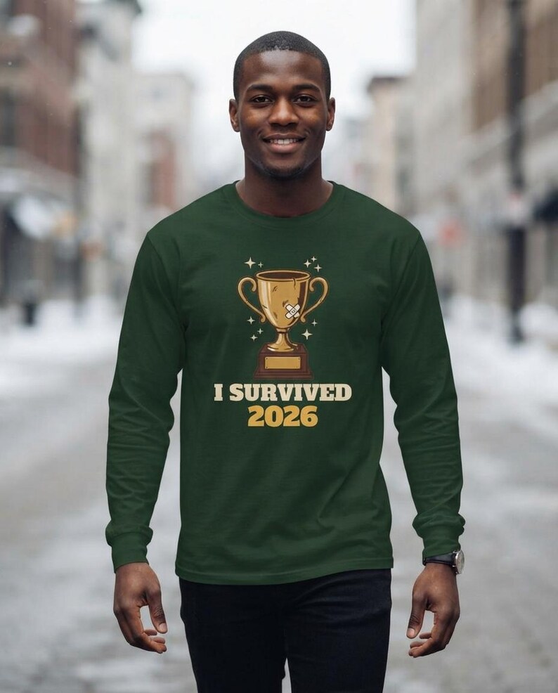 I Survived 2026 Trophy Tee, Funny Battered Trophy Shirt, We Made It Top Bild 10