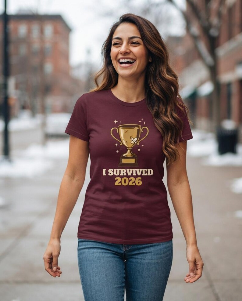 I Survived 2026 Trophy Tee, Funny Battered Trophy Shirt, We Made It Top Bild 9