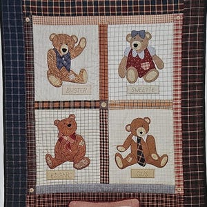 May include: A fabric panel featuring four teddy bears, each in a different pose and outfit, with names like Buster and Sweetie. The panel is framed with a plaid border and includes a smaller pillow design with a bear named Daisy. The text "Old Bears" is at the top.