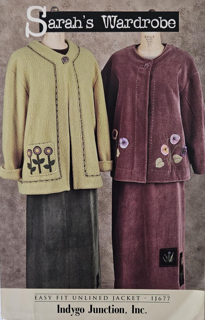 May include: Two jackets and skirts are displayed. One is a light olive green fleece jacket with floral embroidery on the pockets, paired with a dark gray skirt. The other is a burgundy velvet jacket and skirt set, also with floral embroidery.