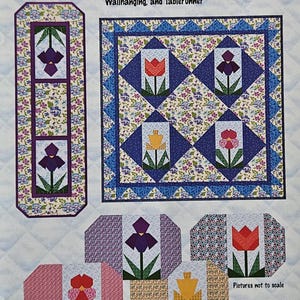 May include: A pattern for quilted placemats, wall hangings, and a tablerunner. The design features colorful tulip and iris motifs in red, purple, and yellow. The text "Get Set for Spring" is displayed at the top.