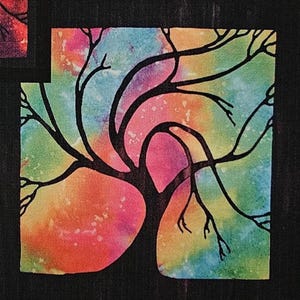 May include: A square artwork featuring a black silhouette of a tree against a vibrant watercolor background. The background transitions from orange to pink, green, and blue. The tree's branches reach across the colorful sky.