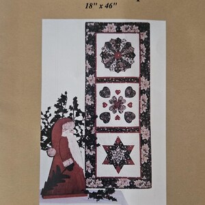 May include: A brown paper pattern envelope for a quilt sampler featuring three blocks. The blocks are a star, a heart, and a circle. The envelope includes the text "Paper Pieces Pre-cut Papers Chrysanthemum, Diamonds & Hearts".