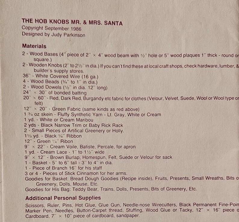 May include: A list of materials needed to make a Mr. and Mrs. Santa craft project. The list includes wood, wire, beads, fabric, yarn, ribbon, and other craft supplies. The text includes the title "The Hob Knobs Mr. & Mrs. Santa" and the copyright date "September 1986".