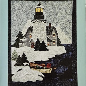 May include: A quilt pattern booklet titled Christmas Light, 2nd in the Lights Along The Shore series by Dottie Krueger for Praise Publications. The cover features a quilted scene of a lighthouse, snow-covered trees, and a boat with gifts.