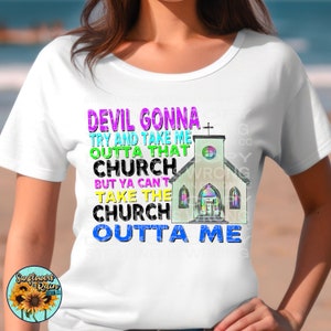 May include: White t-shirt with a colorful graphic of a church and the text "DEVIL GONNA TRY AND TAKE ME OUTTA THAT CHURCH BUT YA CAN'T TAKE THE CHURCH OUTTA ME".