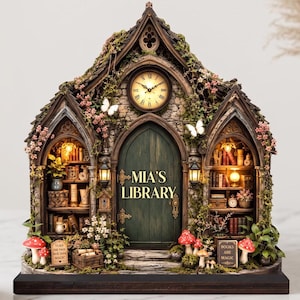 May include: A miniature library structure featuring a dark green door with the text 'MIA'S LIBRARY', an analog clock above, and two side alcoves filled with books. The exterior is decorated with moss, vines, pink flowers, white butterflies, and red mushrooms.