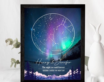May include: A framed print with a dark blue background featuring a constellation map with a white circle around it. The constellation map is set against a backdrop of a colorful aurora borealis. The text below the map reads "Henry & Jennifer, The night we said forever, 11/21/2020 | Under the night sky."