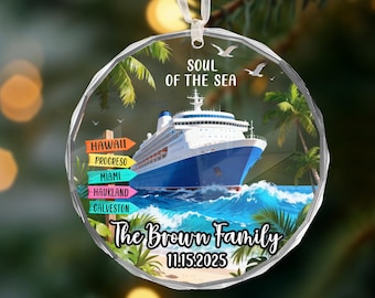 May include: A clear, round Christmas ornament featuring a cruise ship on blue water with palm trees. The ornament has the text "SOUL OF THE SEA", "The Brown Family", and "11.15.2025". Colorful directional signs point to Hawaii, Progreso, Miami, Haukland, and Galveston.